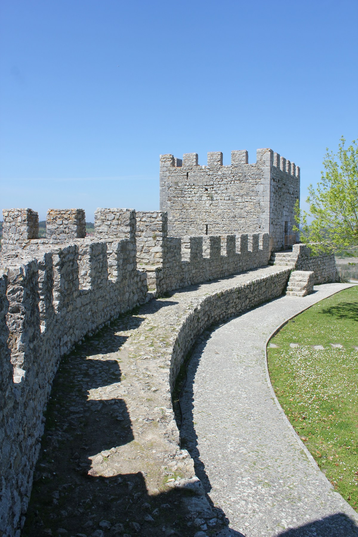 Medieval castle battlements and stone walkway along the ancient walls of Obidos, Portugal