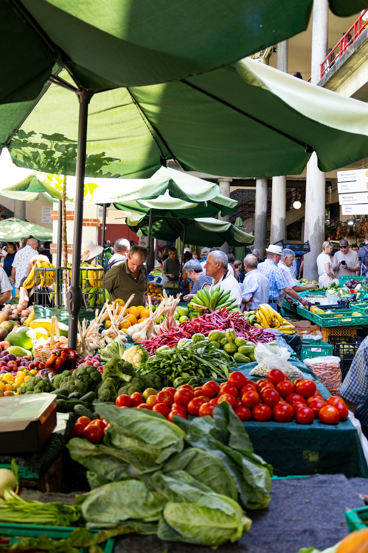 Fresh produce and exotic fruits on display at the Mercado dos Lavradores market in Funchal, Madeira