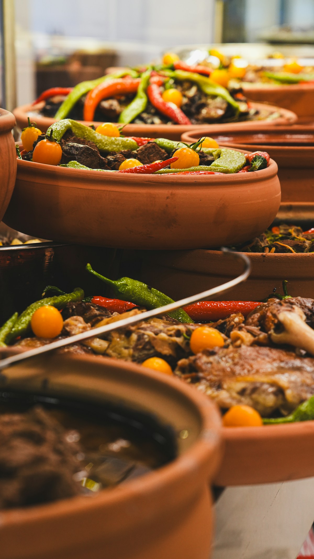 Clay pots filled with stewed meat and vegetables - traditional alcatra-style cooking in the Azores