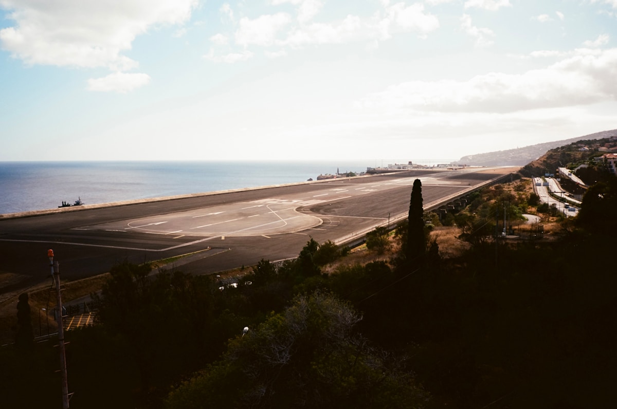 Madeira Airport (FNC) runway extending over the Atlantic Ocean at Santa Cruz, Madeira, Portugal