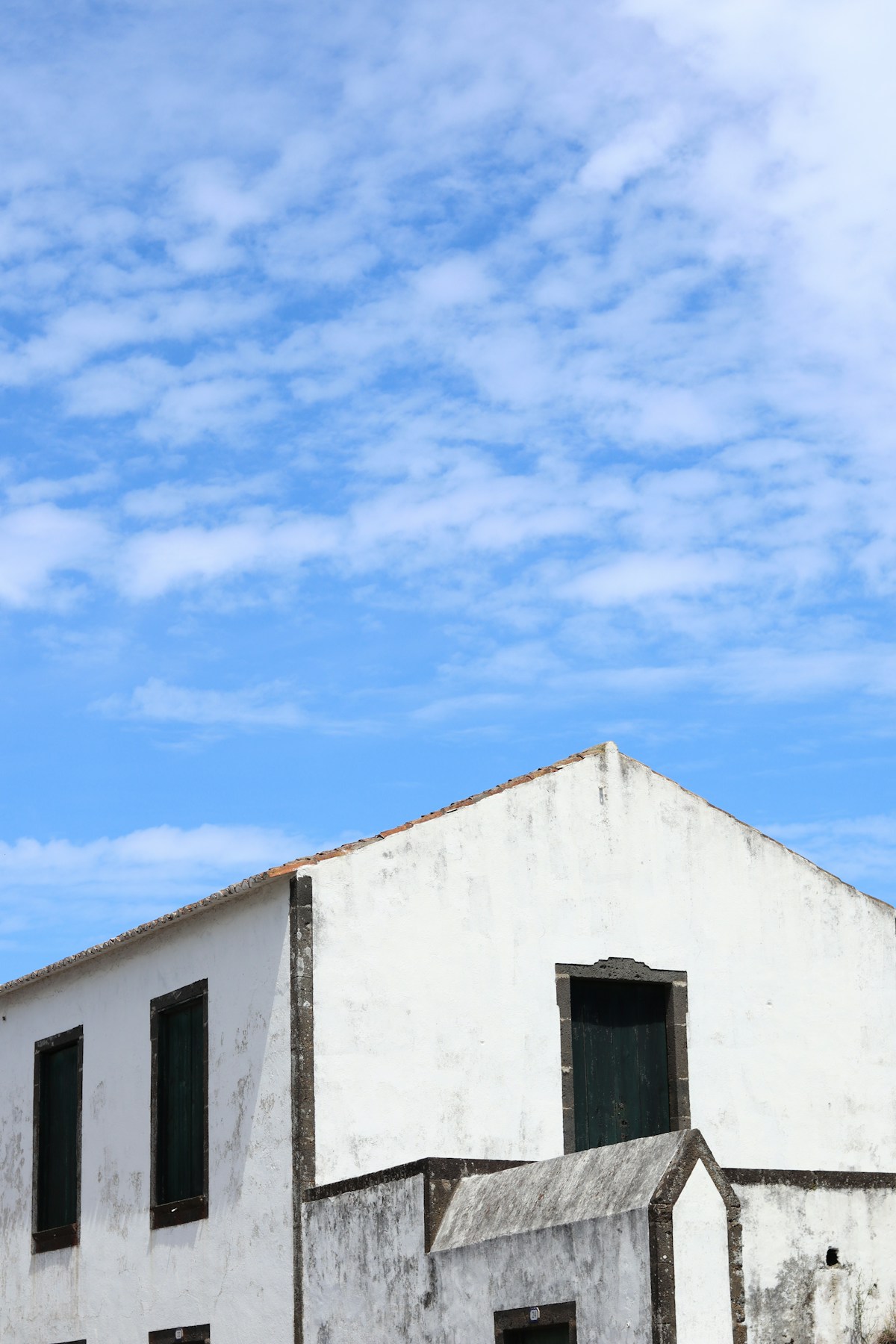 Traditional white Azorean building with black basalt trim, Graciosa island, Azores
