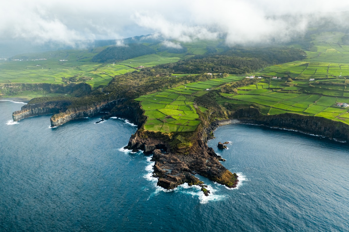 Aerial view of dramatic green coastal cliffs and sea, São Jorge island, Azores