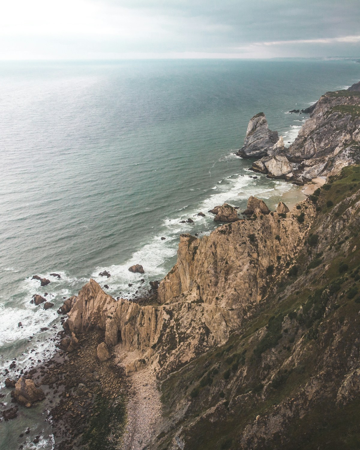 Aerial view of Atlantic cliffs and surf near Cabo da Roca on Portugal's west coast
