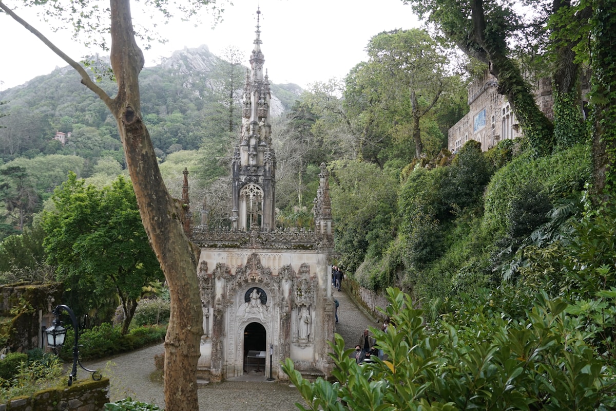 Ornate Gothic chapel nestled in lush grounds at Quinta da Regaleira, Sintra - top day trip from Lisbon