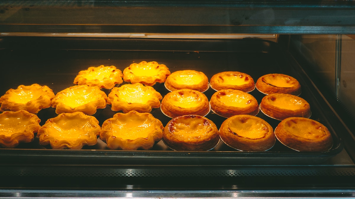 Pastéis de nata on a counter at a Lisbon pastelaria
