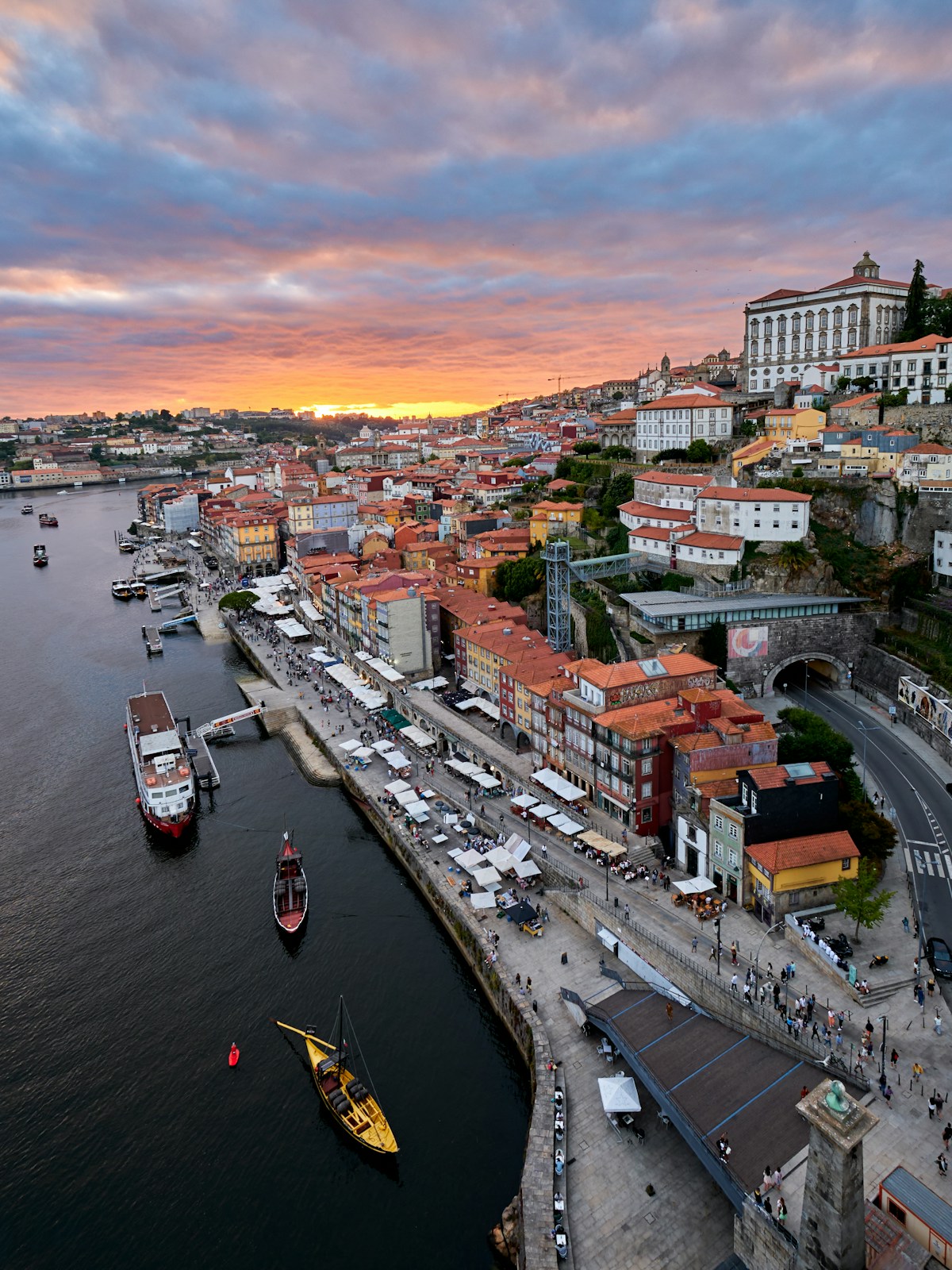 Porto's ribeira waterfront with colourful buildings and the Dom Luís I bridge across the Douro