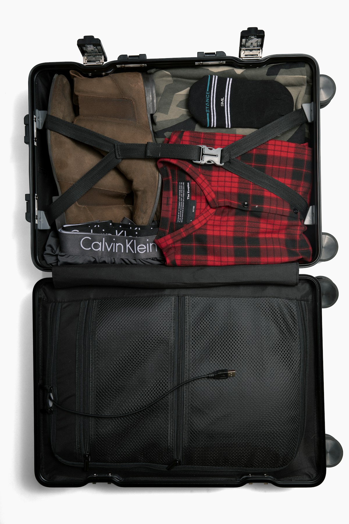 A packed travel bag with Portuguese tiles in the background