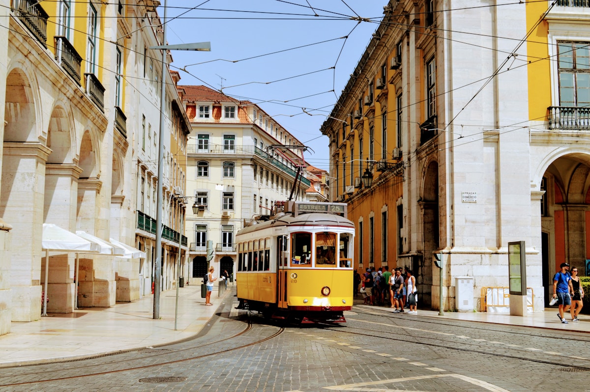 Colourful tram on a hillside street in Lisbon, Portugal