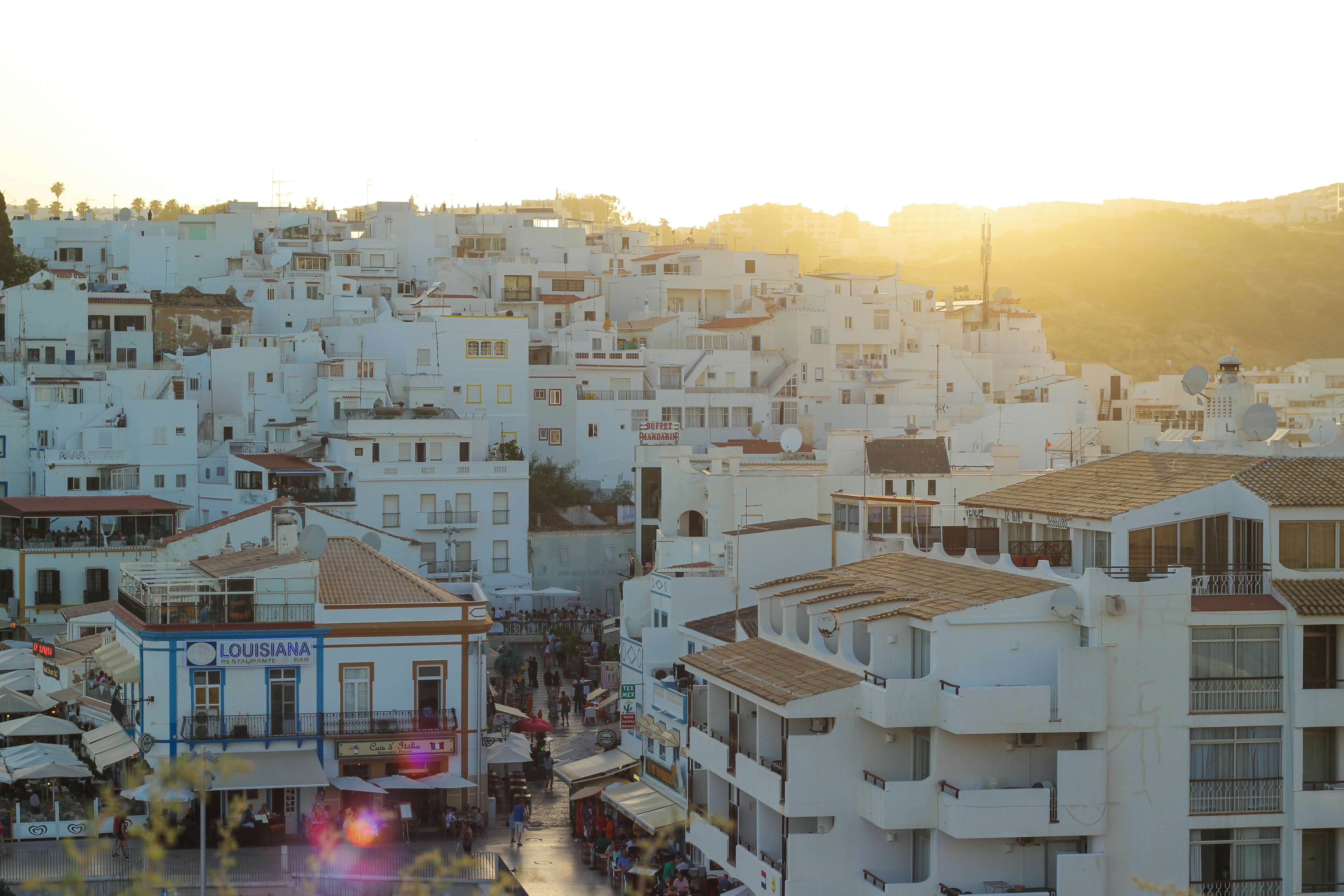 Whitewashed town buildings at golden hour, Albufeira, Algarve, Portugal
