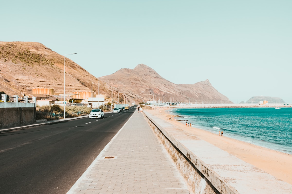 Coastal road and promenade running beside the golden sandy beach, Porto Santo island, Madeira, Portugal