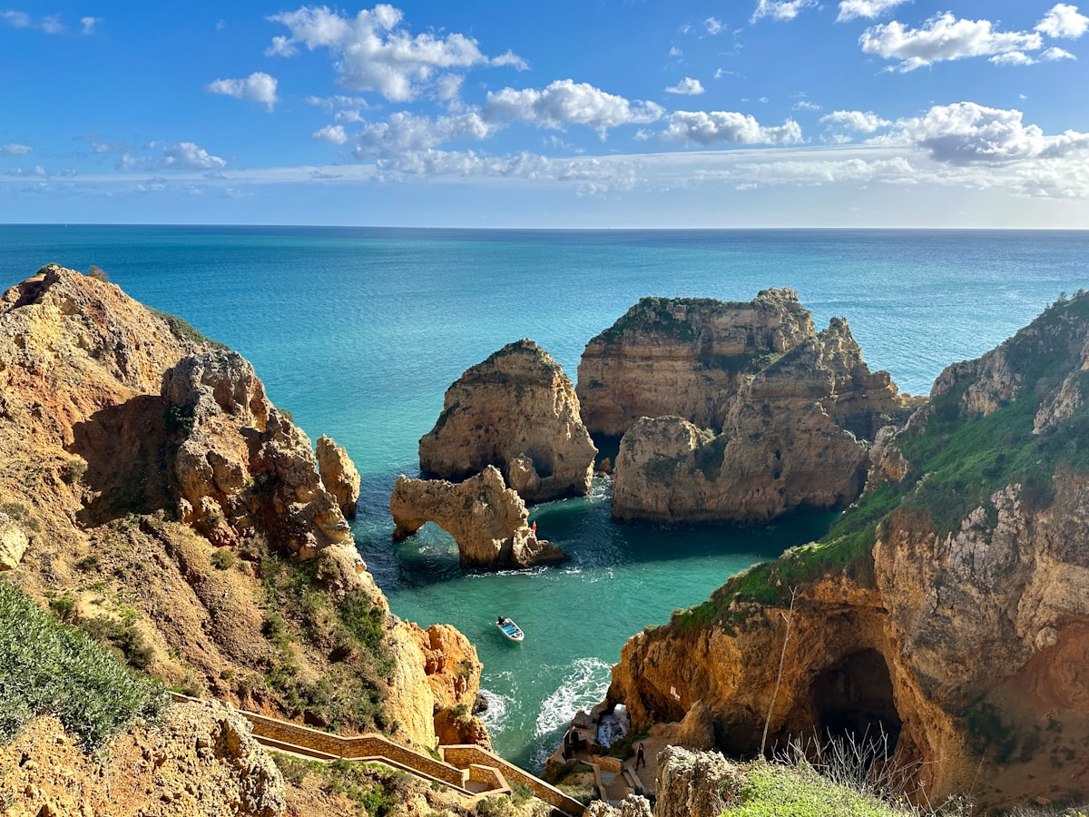 Golden limestone sea arches and turquoise water at Ponta da Piedade, Lagos, Algarve, Portugal